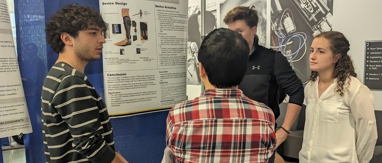 Students talking during research open house