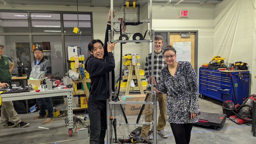 Jinann Abudagga and team with their robot for FRC 2025.